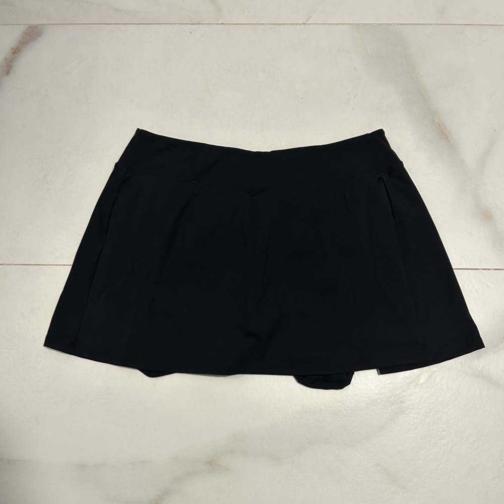 Black mini skirt with shorts under.